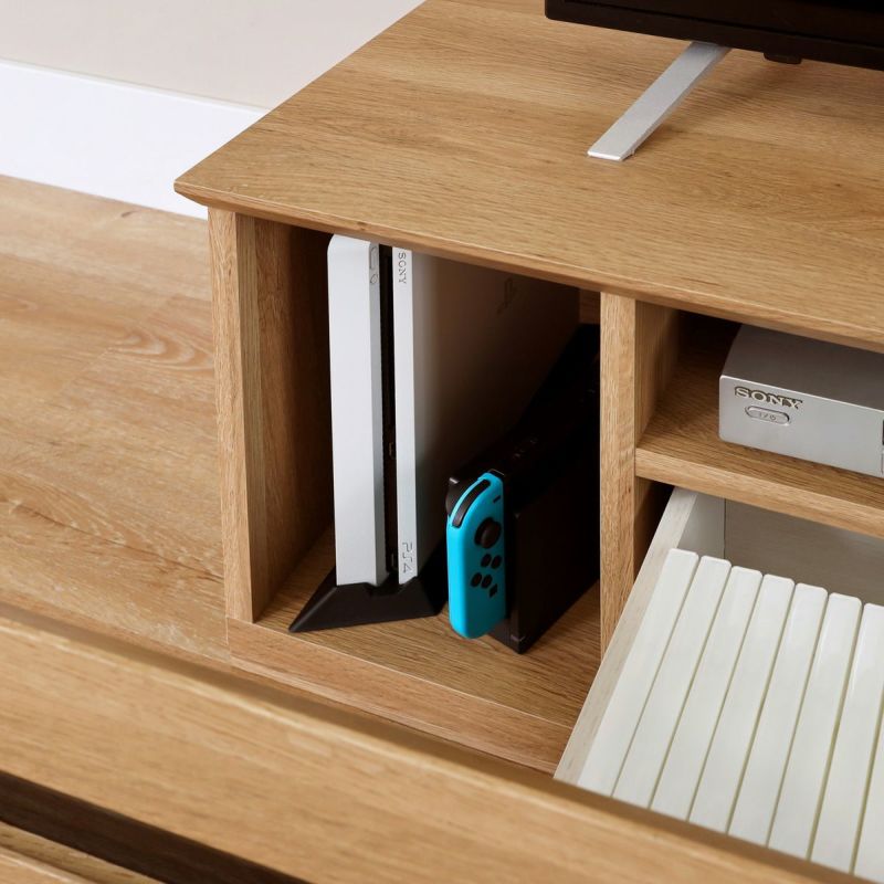 [縦置きゲーム機などの収納]引き出しの横には、Switchなど縦型ゲーム機やWi-Fiルーターなどが入るスペースがあります。